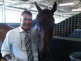 Steve Allam hugs Lone Command after his class record win at Rosehill