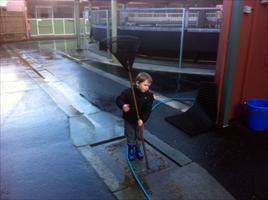 Lachlan cleaning the Flemington stables