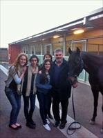 Leo Tsatsaronis and family with Federation Square catching up on all the gossip at Flemington