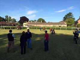 William Haggas looks @ some of his horses @ his yard that have just worked @Newmarket