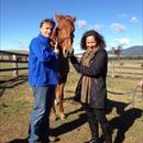 Chris and Jane sharing the love with their mare Legally Bay...