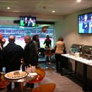 Hawkes Racing's clients enjoy the hospitality at the AFL football...