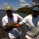 Steve Allam and Brett Gilbert with a Mud Crab Steve Allam and Brett Gilbert with a Mud Crab